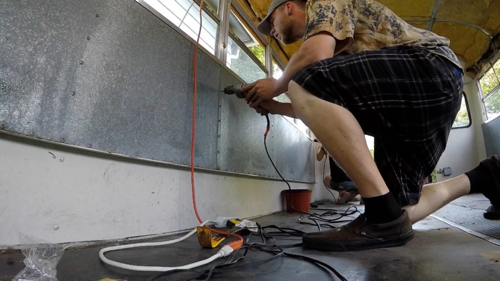 Removing windows and wall panels in our bus conversion